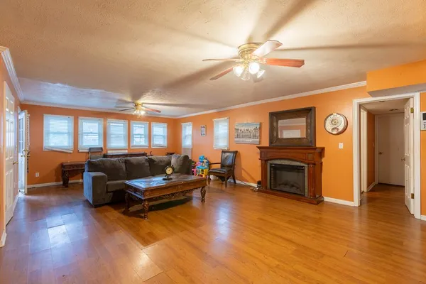 a living room with furniture and a fireplace