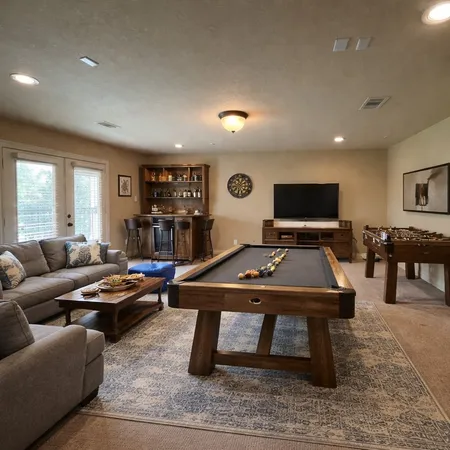 a living room with furniture pool and a table