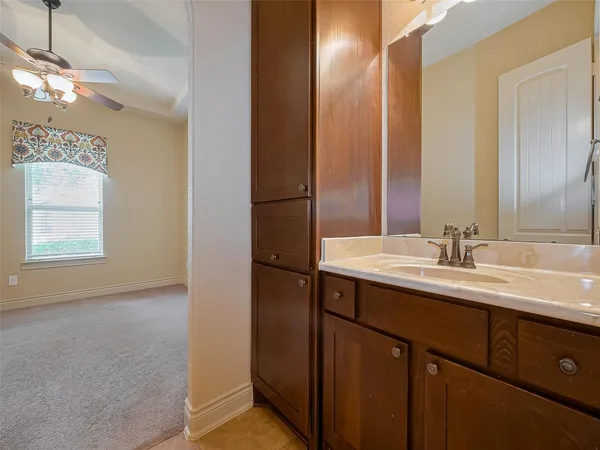 a bathroom with a double vanity sink and a mirror