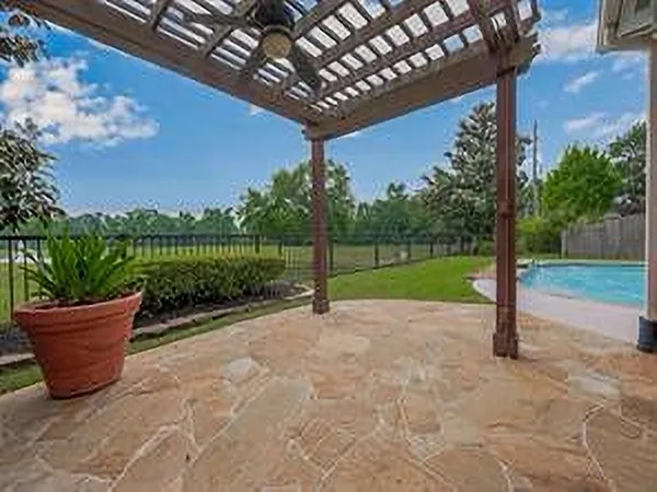 a view of a patio with couches chairs and potted plants