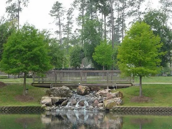 an aerial view of a swimming pool playground and mountain view