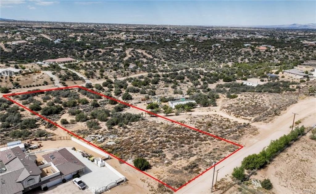 an aerial view of a residential buildings and street