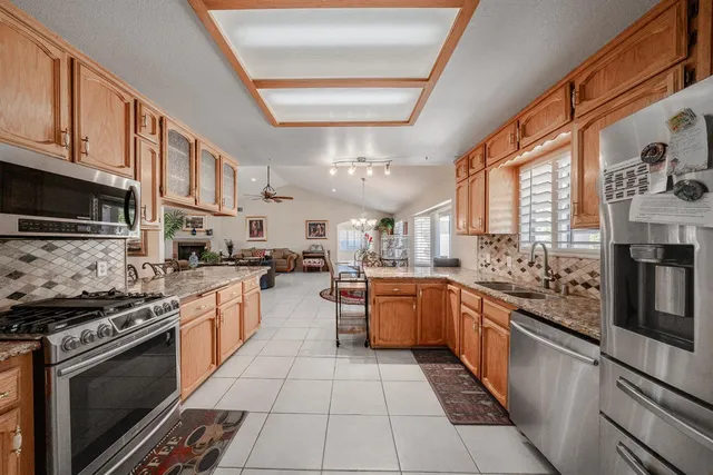 a view of a livingroom with lounge chair and a window