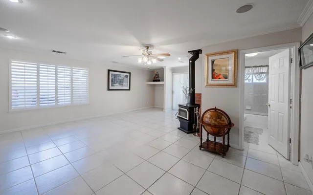 a view of a livingroom with furniture and a flat screen tv