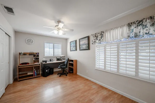 a bathroom with a granite countertop sink mirror and bathtub
