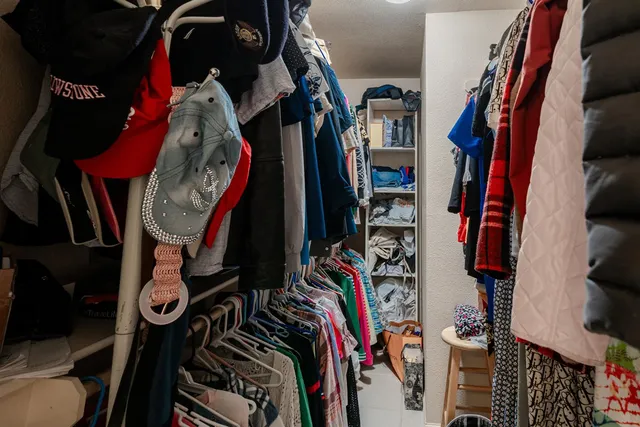 a living room with furniture large window and fireplace