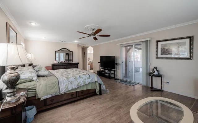a view of a patio with table and chairs under an umbrella