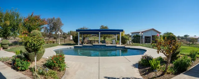 a view of a backyard of the house