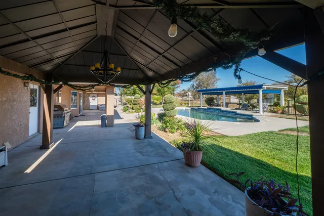 a dining room with furniture and garden view