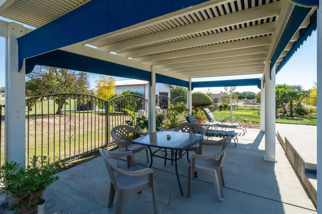 a view of a swimming pool with a lounge chair