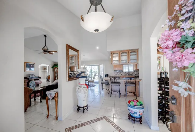 a kitchen with stainless steel appliances granite countertop a stove and white cabinets
