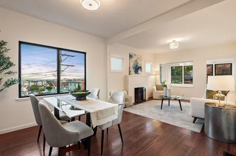 a dining room with furniture window wooden floor