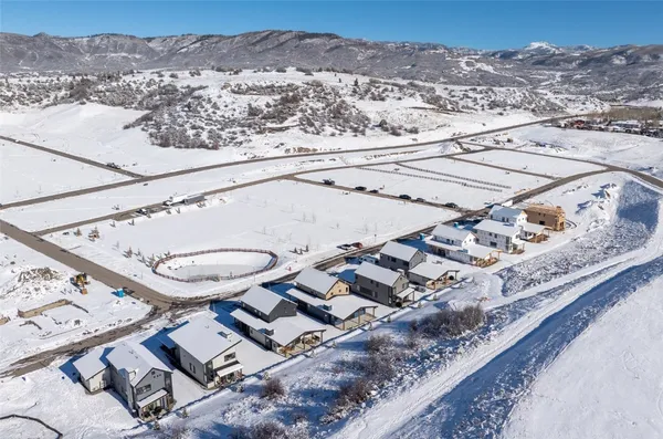 a view of a house with a small yard