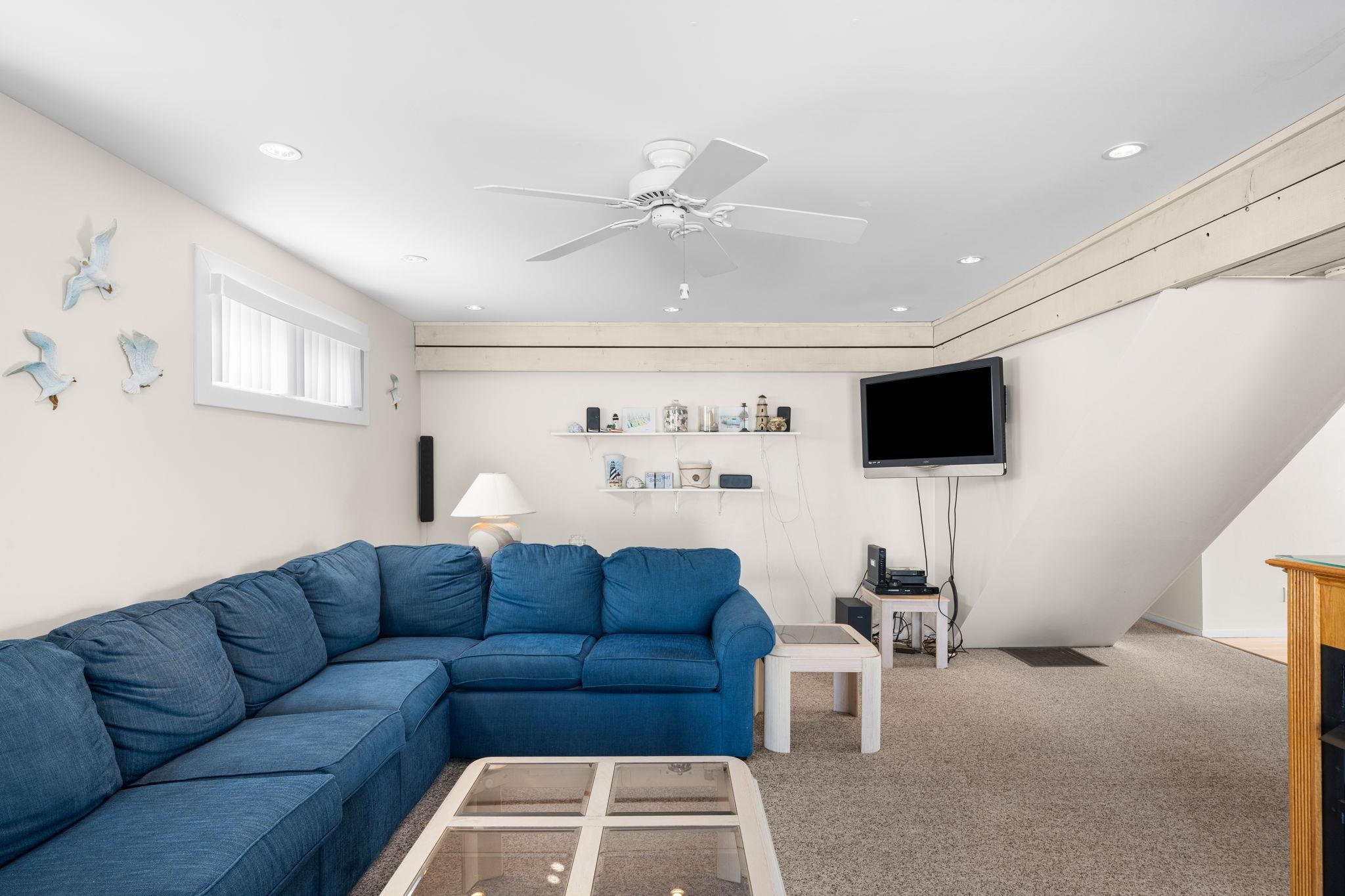 45 19th Street Avalon, NJ 08202 - Photo 16 of 50 a living room with furniture and a flat screen tv