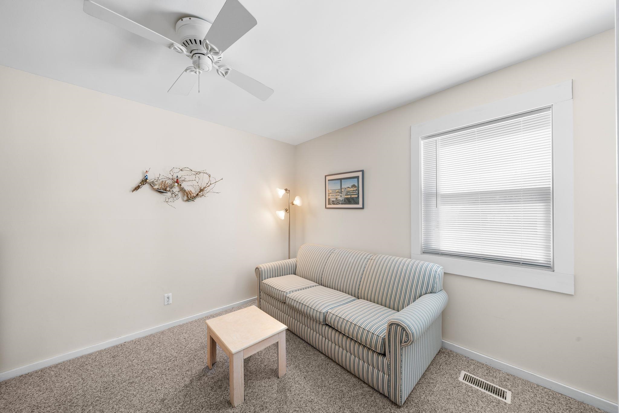 45 19th Street Avalon, NJ 08202 - Photo 20 of 50 a living room with furniture and a window