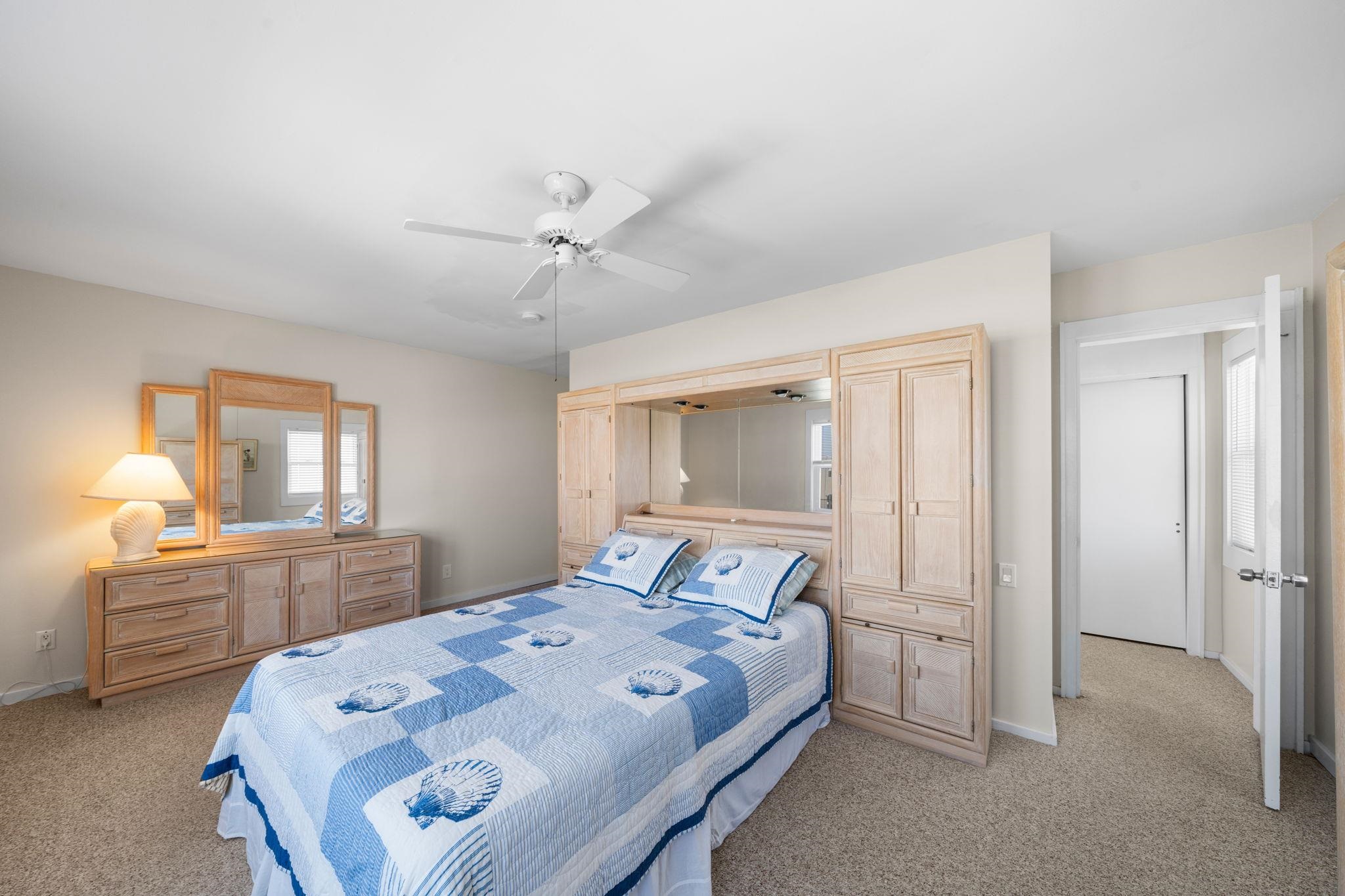 45 19th Street Avalon, NJ 08202 - Photo 25 of 50 a bedroom with a bed and a desk