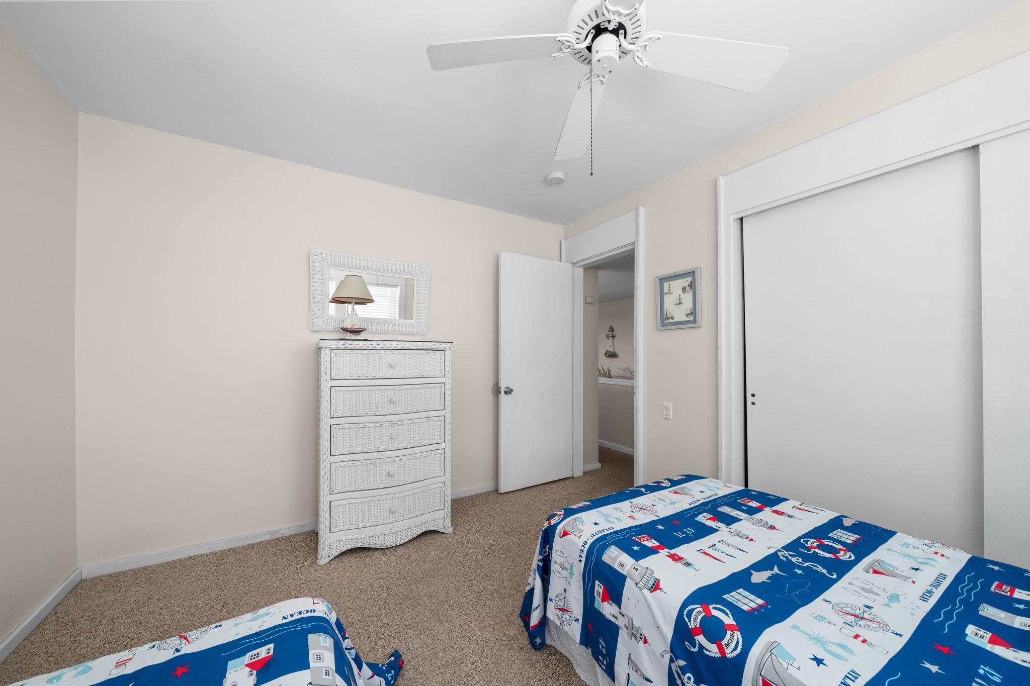 45 19th Street Avalon, NJ 08202 - Photo 35 of 50 a bedroom with a bed and a dresser