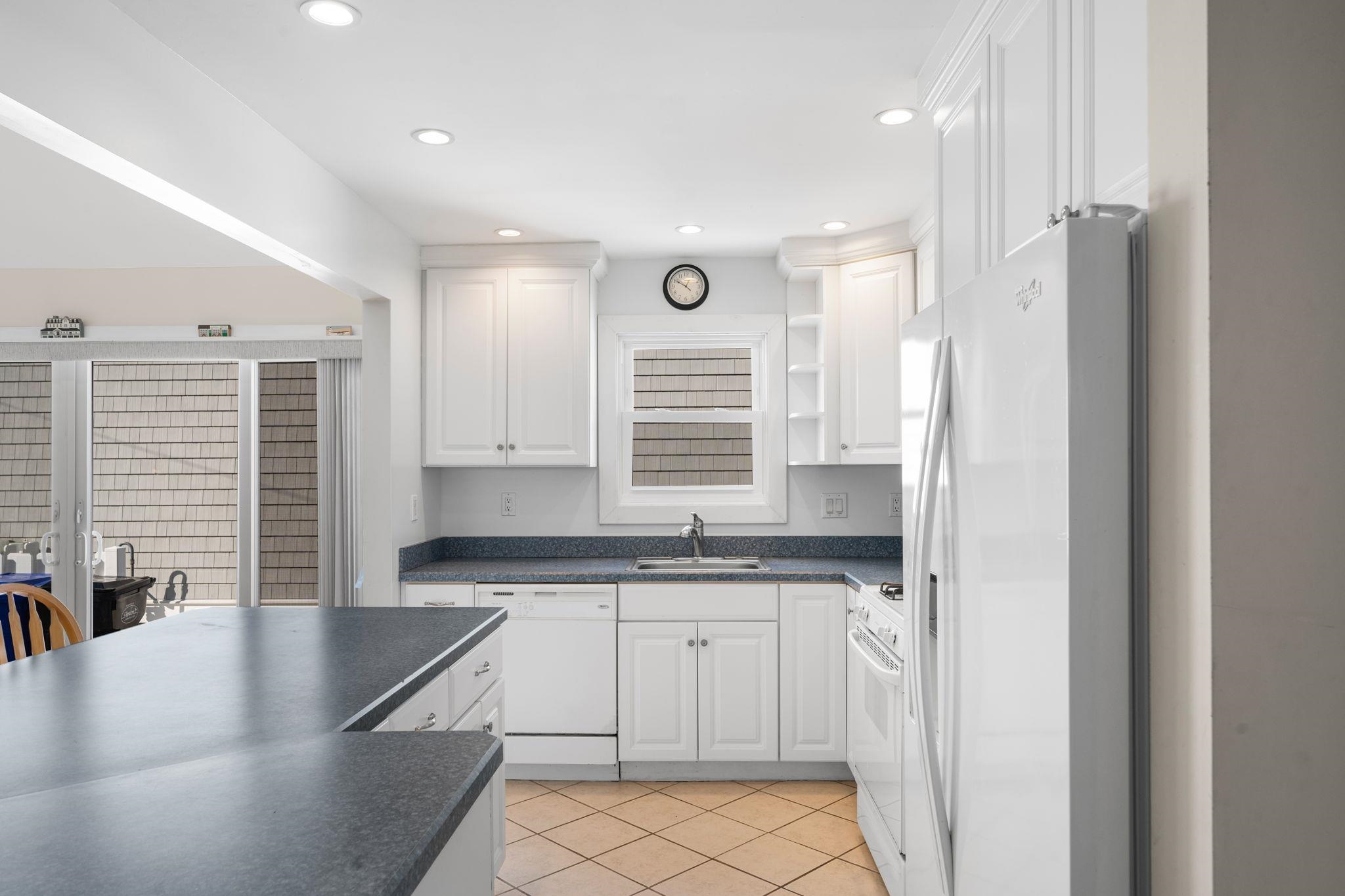 45 19th Street Avalon, NJ 08202 - Photo 10 of 50 a kitchen with stainless steel appliances granite countertop a sink and a stove