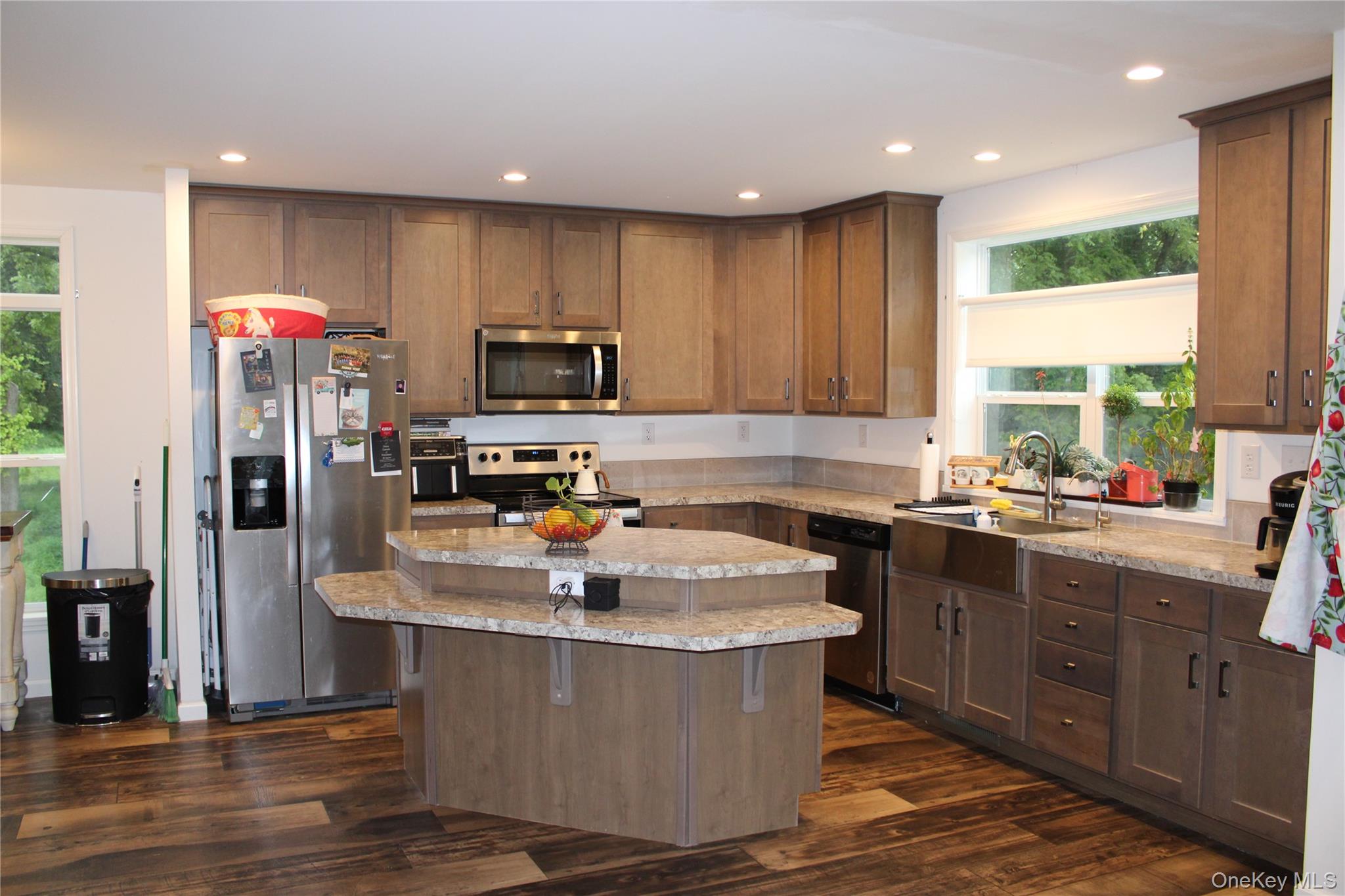 155 Metzger Road Red Hook, NY 12571 - Photo 11 of 29 Kitchen featuring appliances with stainless steel finishes, recessed lighting, a kitchen island, dark wood finished floors, and light stone counters