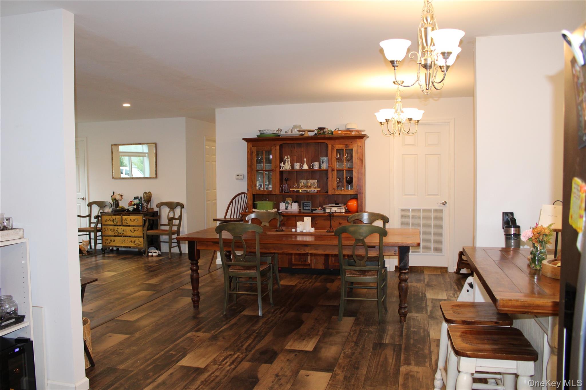 155 Metzger Road Red Hook, NY 12571 - Photo 13 of 29 Dining room featuring dark wood finished floors and a chandelier