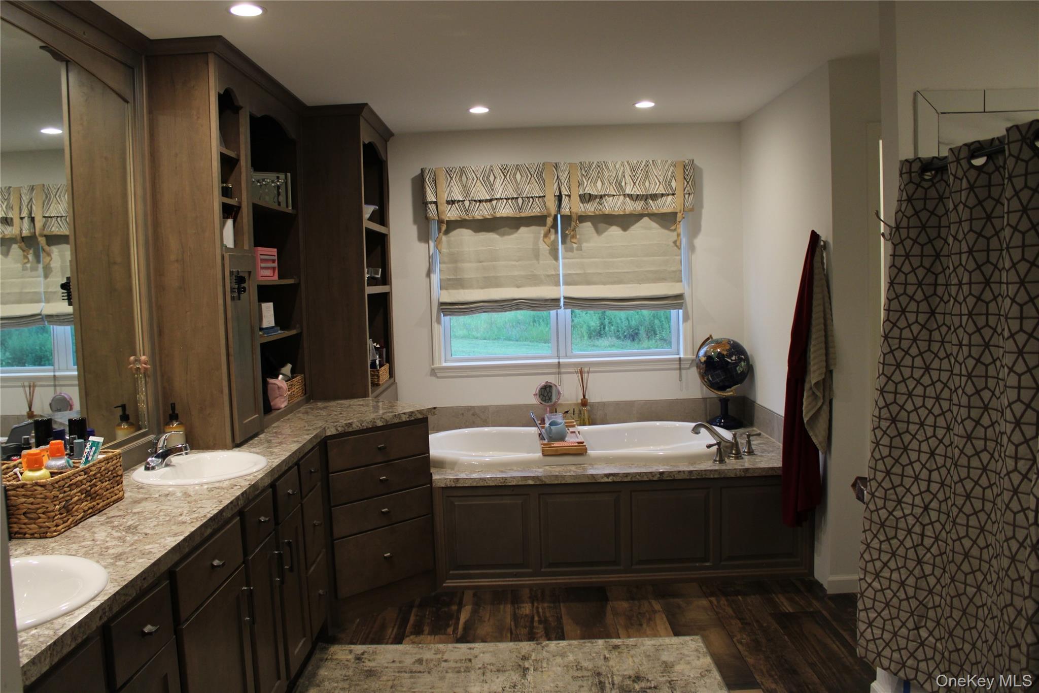 155 Metzger Road Red Hook, NY 12571 - Photo 19 of 29 Bathroom featuring dark wood finished floors, a garden tub, double vanity, and recessed lighting
