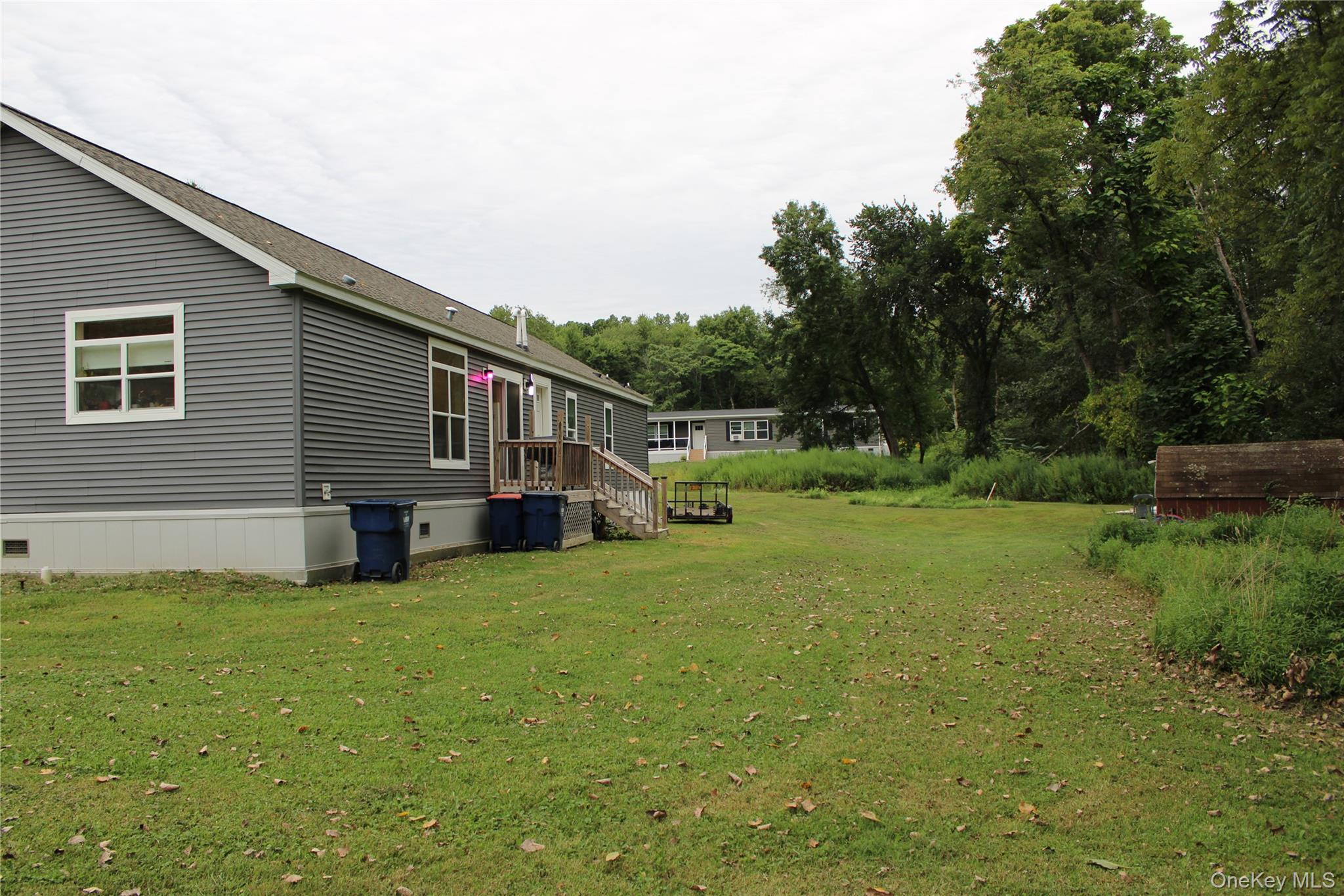 155 Metzger Road Red Hook, NY 12571 - Photo 3 of 29 View of green lawn featuring view of scattered trees