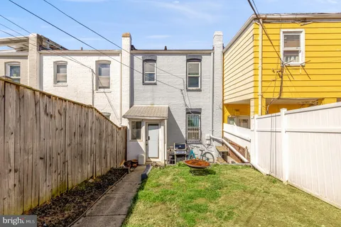 a view of a front door and small yard