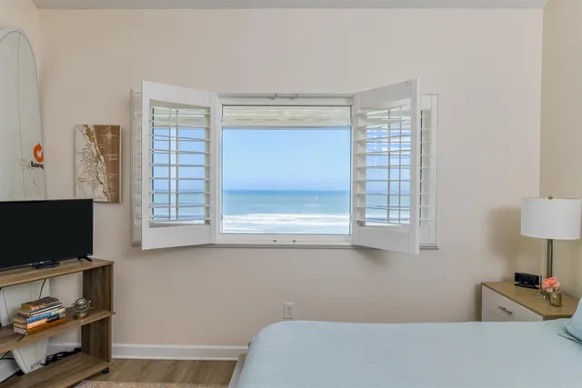 a bedroom with a bed and night stand