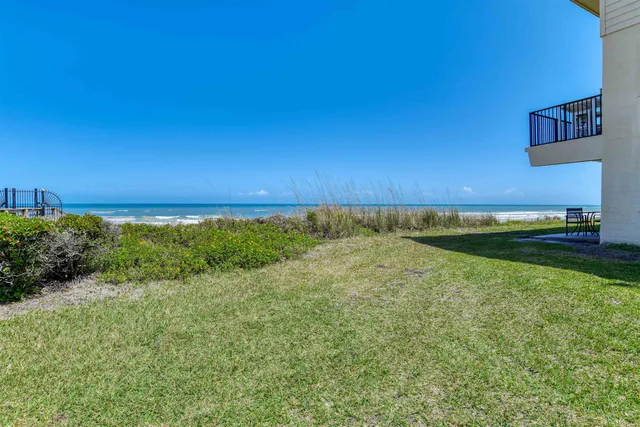 a view of house with backyard porch and outdoor seating