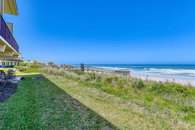 a view of lake with green space
