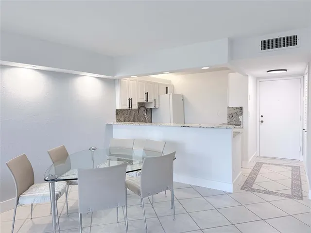 a bathroom with a glass door shower