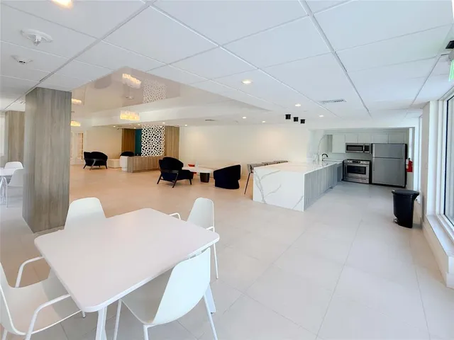 a view of a patio with a table and chairs