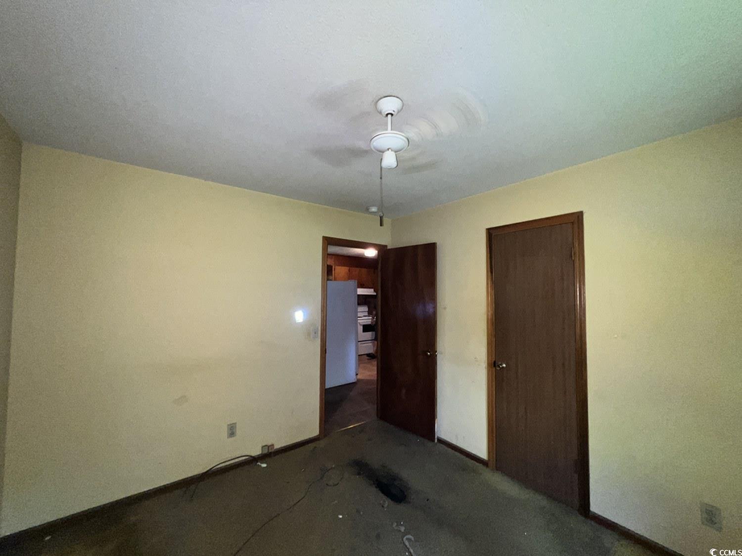 41 Harmon Street Hemingway, SC 29554 - Photo 13 of 20 Unfurnished bedroom featuring baseboards, a ceiling fan, carpet, and a closet
