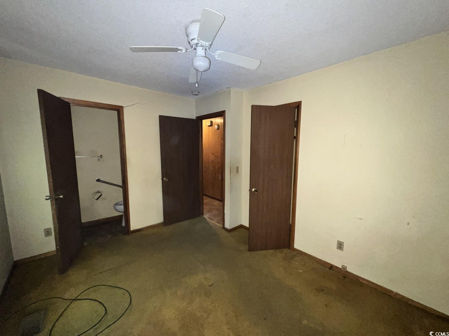 41 Harmon Street Hemingway, SC 29554 - Photo 15 of 20 Unfurnished bedroom featuring carpet, baseboards, and a ceiling fan