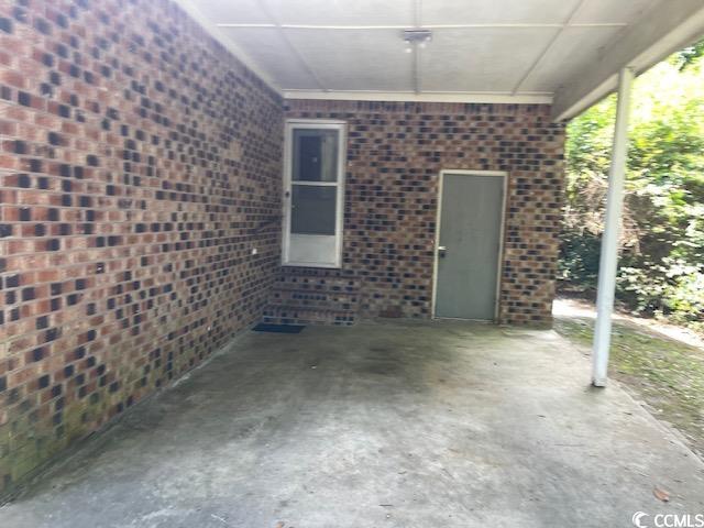 41 Harmon Street Hemingway, SC 29554 - Photo 3 of 20 View of patio with entry steps