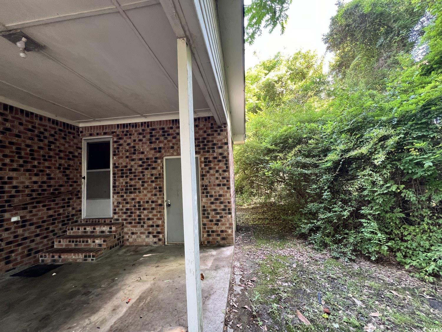 41 Harmon Street Hemingway, SC 29554 - Photo 4 of 20 View of patio with entry steps