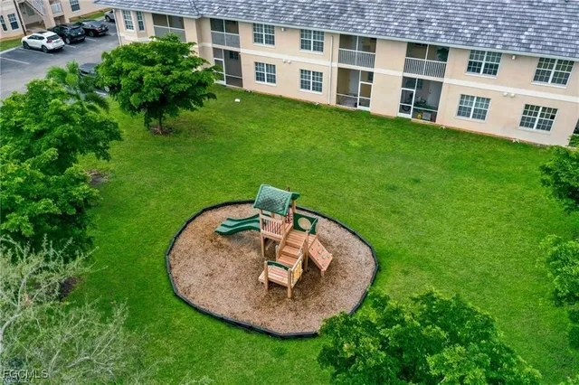 a backyard of a house with a garden and barbeque oven