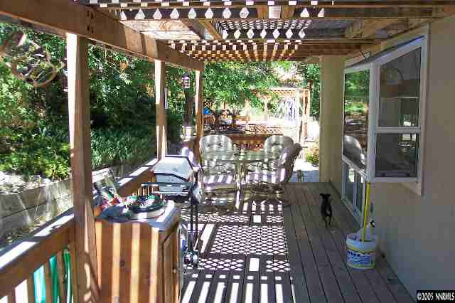 1412 Keystone Avenue Reno, NV 89503 - Photo 5 of 6 a view of a patio with a table chairs and backyard