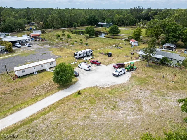 a view of a lake with lawn chairs