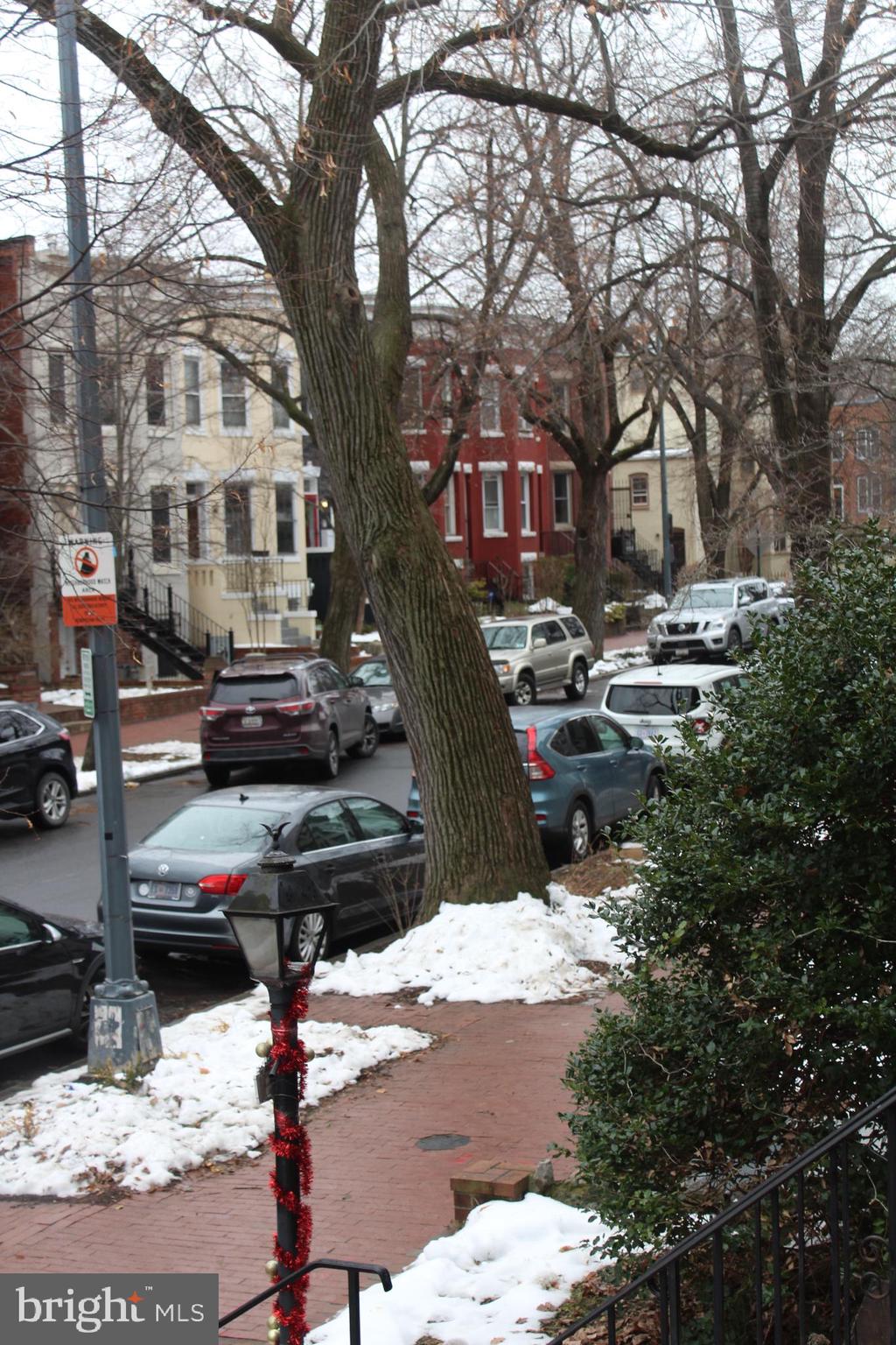 636 5th Street Northeast Washington, DC 20002 - Photo 16 of 16 a wooden bench sitting in front of a building