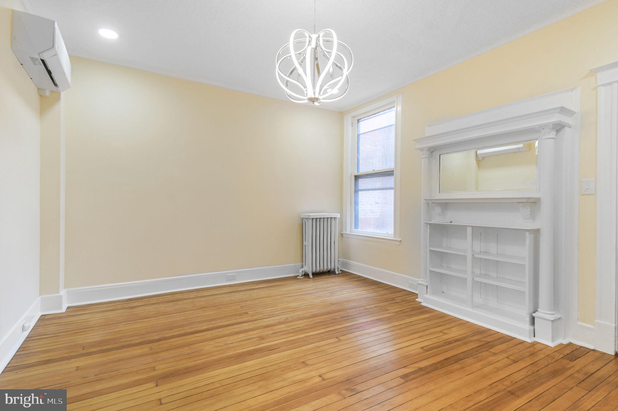 636 5th Street Northeast Washington, DC 20002 - Photo 9 of 16 a view of empty room with wooden floor and fan