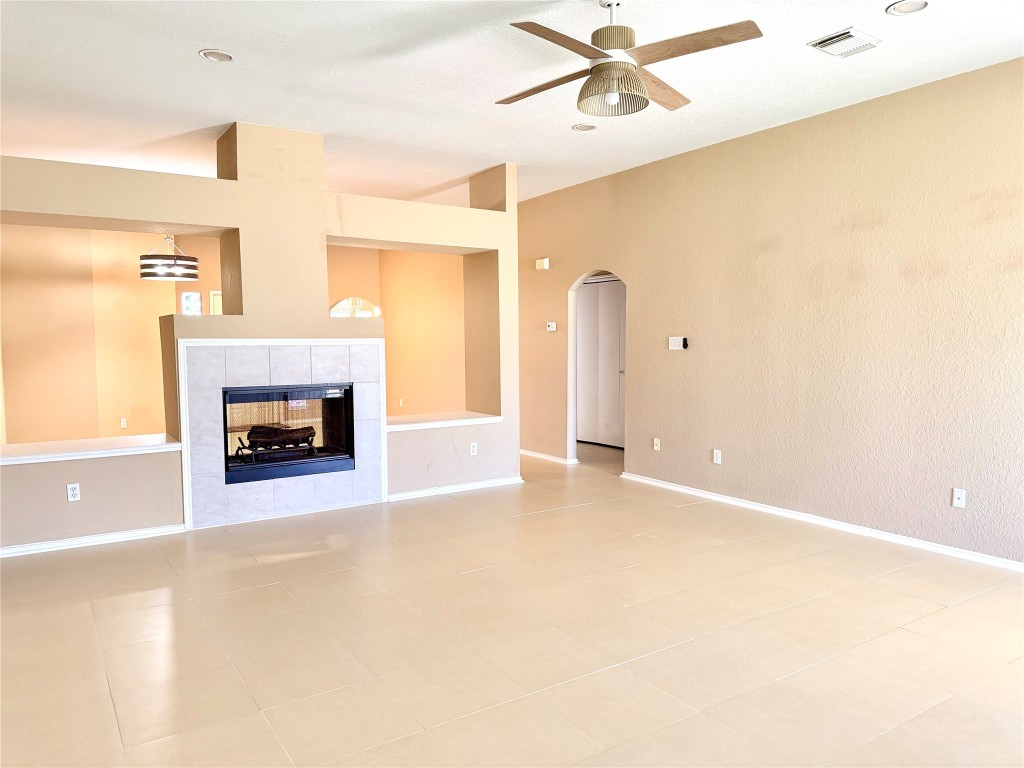 23023 Canal Road Richmond, TX 77406 - Photo 11 of 30 a view of a livingroom with a fireplace and a window