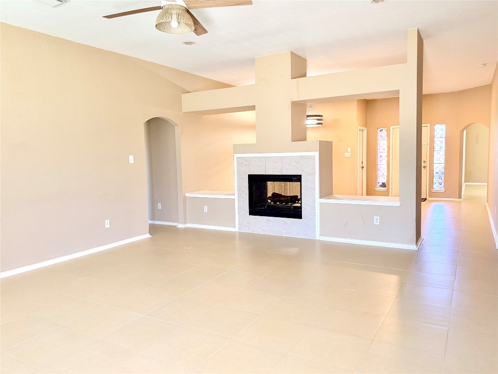 23023 Canal Road Richmond, TX 77406 - Photo 12 of 30 a view of an empty room with window and fire place