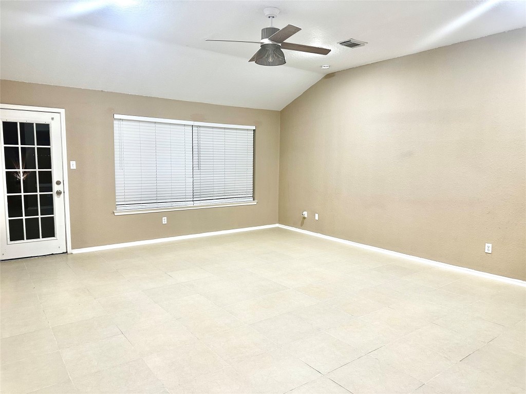 23023 Canal Road Richmond, TX 77406 - Photo 15 of 30 an empty room with windows and ceiling fan