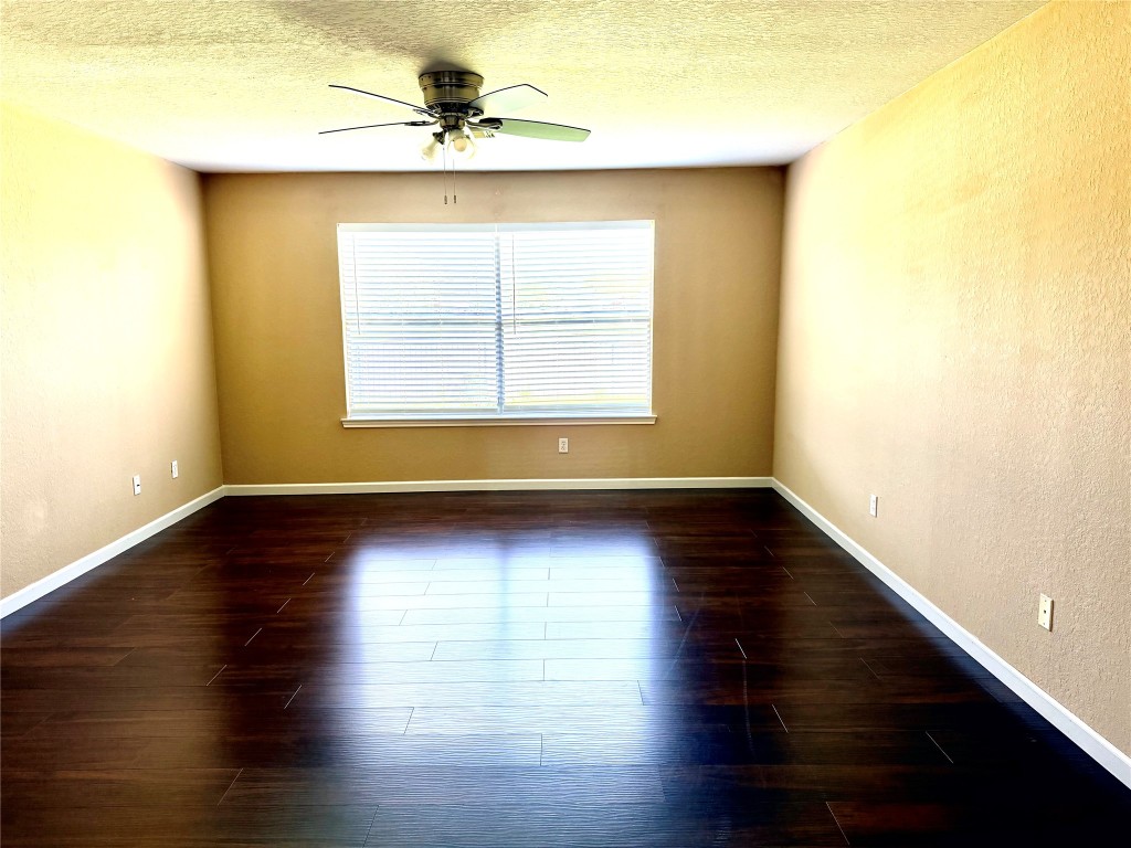 23023 Canal Road Richmond, TX 77406 - Photo 20 of 30 a view of a livingroom with wooden floor and a window