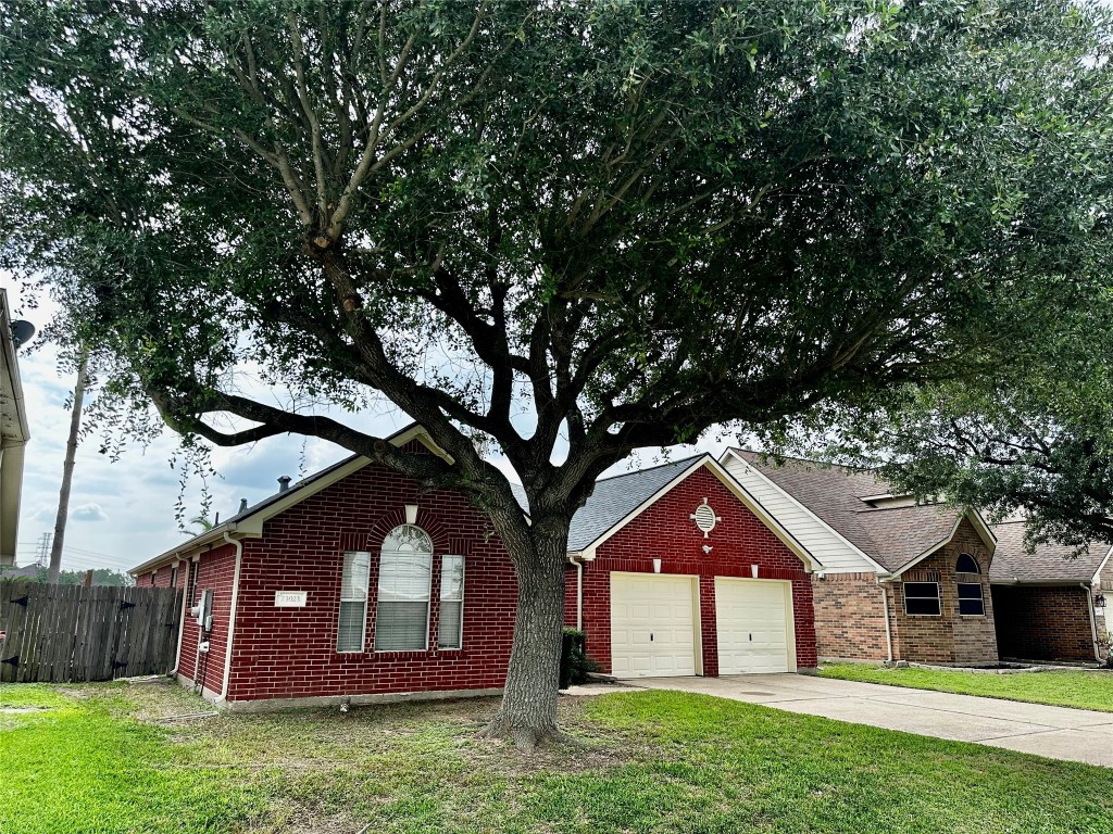 23023 Canal Road Richmond, TX 77406 - Photo 2 of 30 a front view of a house with a yard