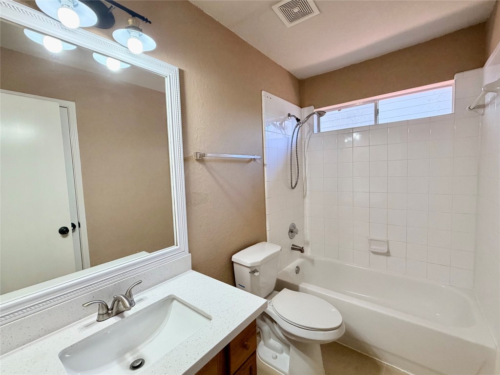 23023 Canal Road Richmond, TX 77406 - Photo 24 of 30 a bathroom with a sink toilet and shower