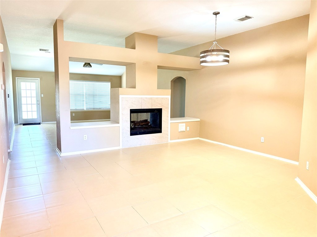 23023 Canal Road Richmond, TX 77406 - Photo 8 of 30 a view of an empty room with a fireplace