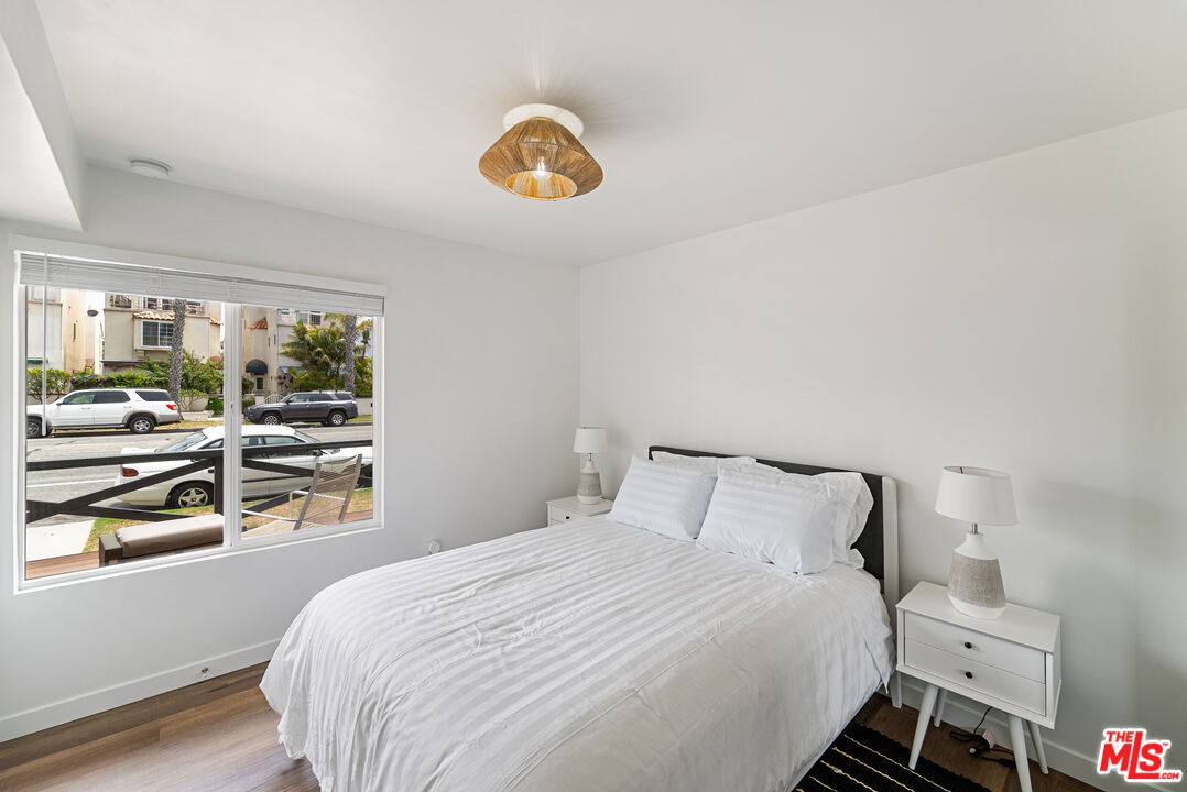 213 17th Street, Unit A Huntington Beach, CA 92648 - Photo 11 of 31 a bedroom with a bed and a window