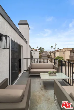 a view of balcony with furniture